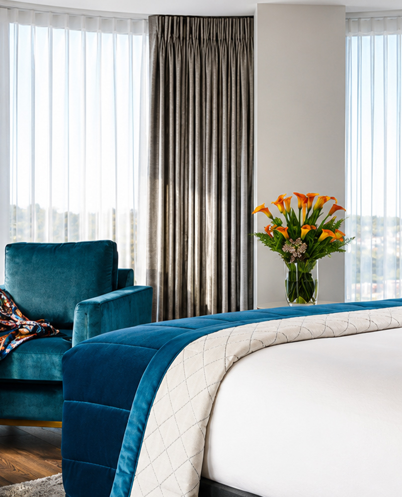 Decorquip grey curtains with white sheer curtains in a modern bedroom