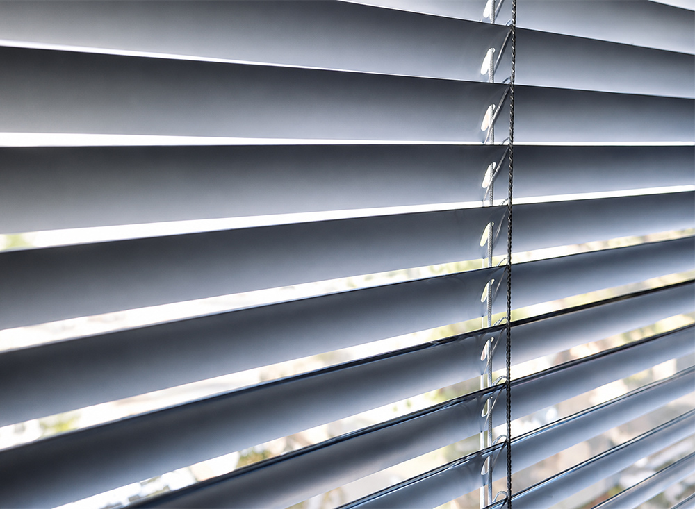 Decorquip grey aluminium Venetian blind with tilted horizontal slats
