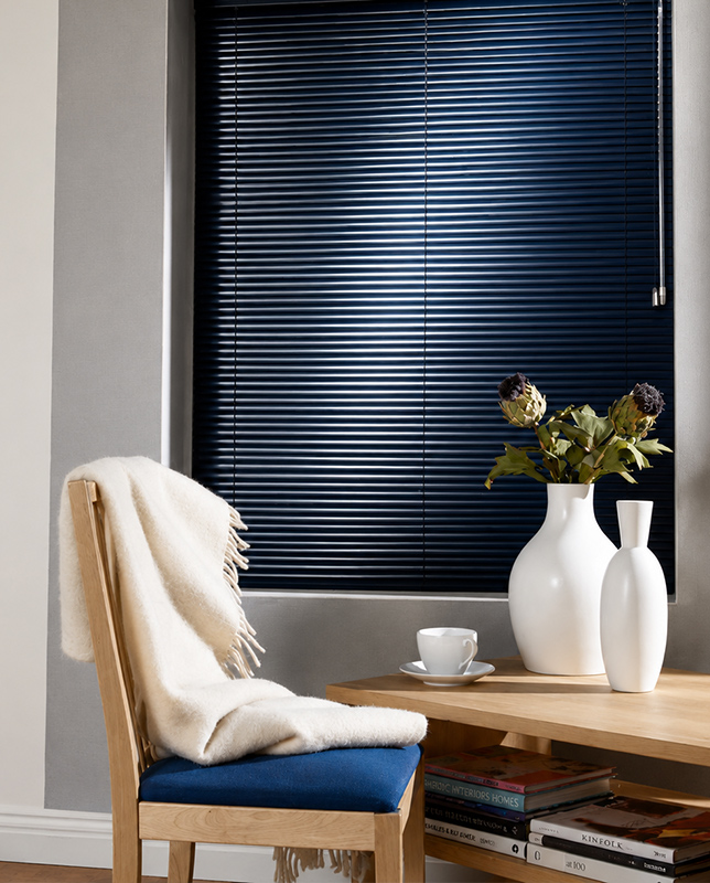 Decorquip navy aluminium Venetian blind lowered over a living room window