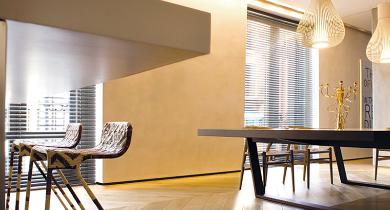 Decorquip grey aluminium Venetian blinds fitted to tall windows in a modern dining room