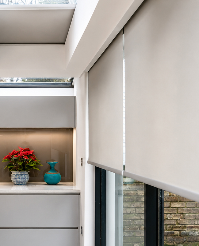 Decorquip grey roller blinds fitted into Blindspace to large kitchen windows and rooflights