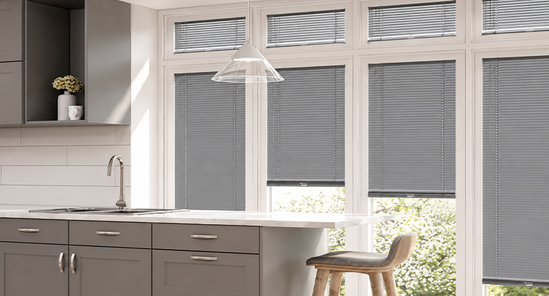 Decorquip grey Perfect Fit Venetian blinds fitted to large windows in a modern kitchen