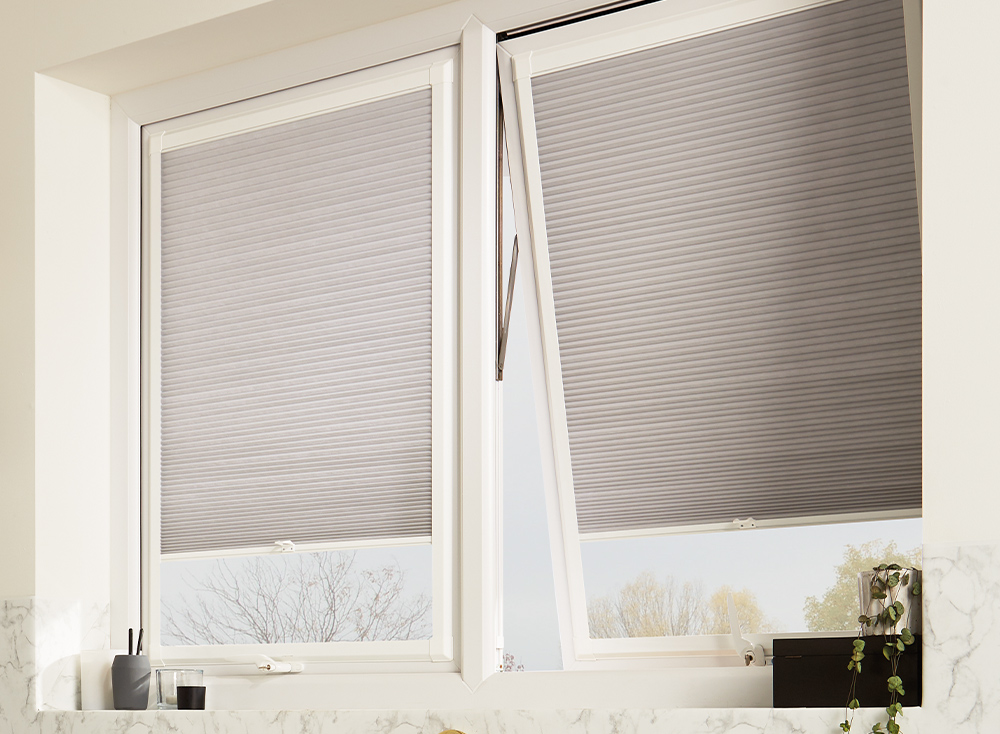 Decorquip grey Perfect Fit pleated blinds fitted to tilt-and-turn windows