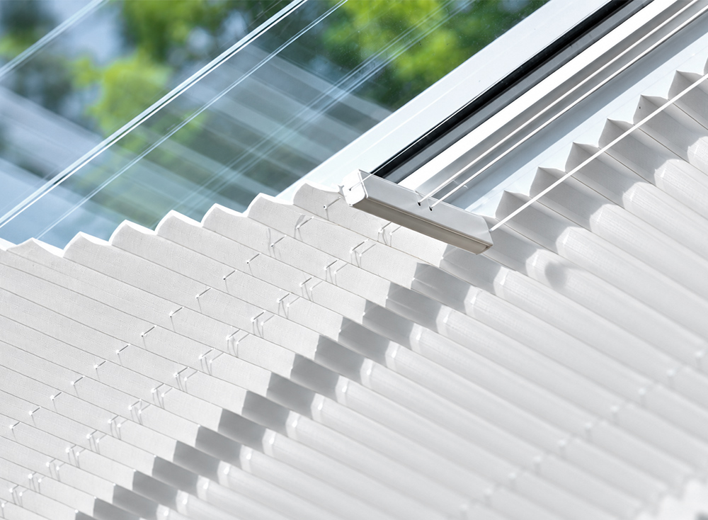 Decorquip white tensioned roof pleated conservatory blind fitted beneath a glazed roof