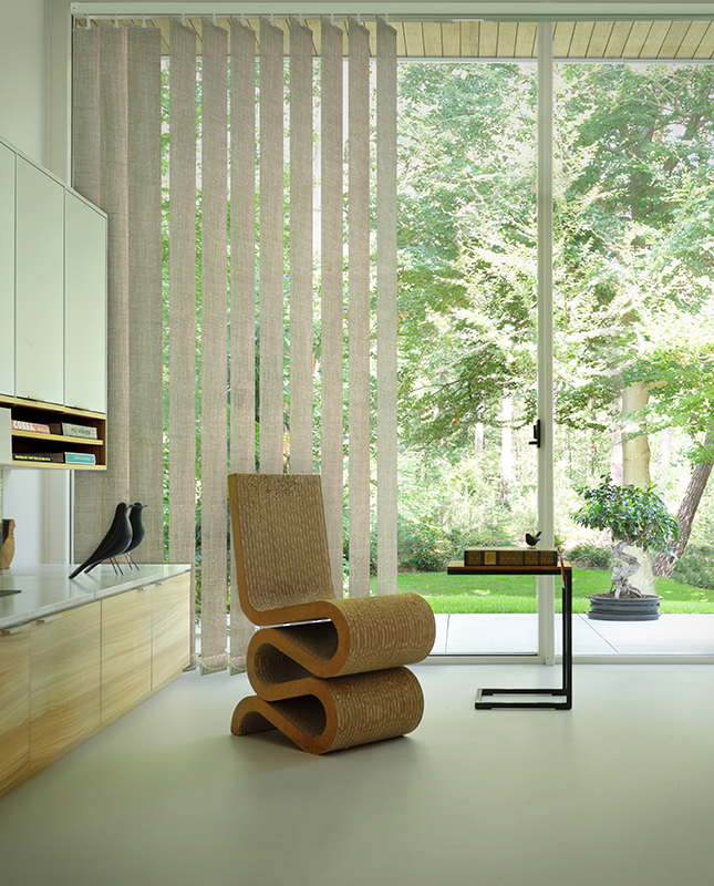 Decorquip light grey vertical blinds covering full-height patio doors in a contemporary living room